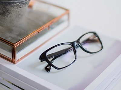 Black eye glasses on books